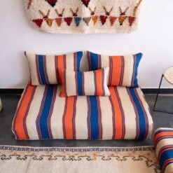 Main image of handmade Moroccan wool floor sofa in Cream with Blue and Orange Stripes – artisan low seating with cushion cover set for cozy boho living rooms