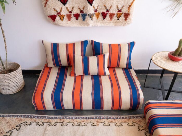 Main image of handmade Moroccan wool floor sofa in Cream with Blue and Orange Stripes – artisan low seating with cushion cover set for cozy boho living rooms