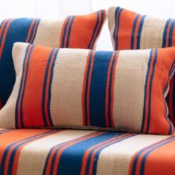 Close-up of cushions from Moroccan wool floor couch in Cream with Blue and Orange Stripes – artisan pillow covers for cozy and stylish home decor