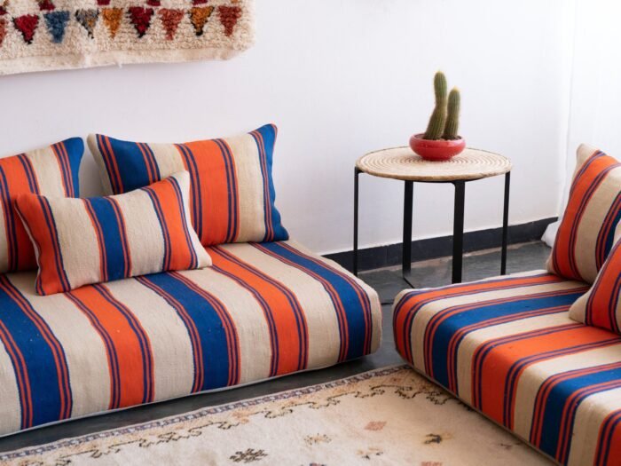 Top view of Moroccan wool floor sofa in Cream with Blue and Orange Stripes – handmade low couch set with cushions for modern bohemian decor