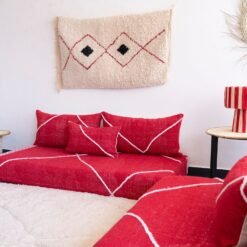 Handcrafted red Moroccan floor seating – bold and stylish sofa with plain cushions for bohemian and modern living rooms