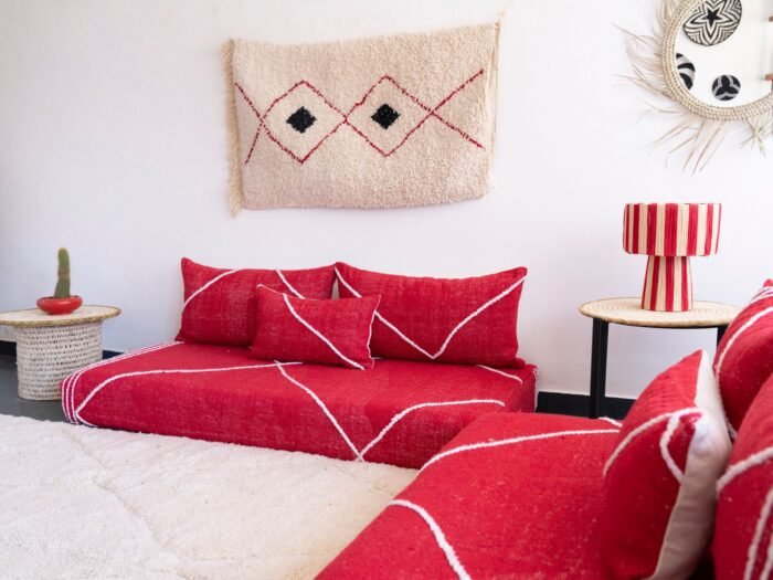 Handcrafted red Moroccan floor seating – bold and stylish sofa with plain cushions for bohemian and modern living rooms