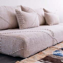 Left view of Moroccan floor seating in beige mixed with white – handmade cover set perfect for airy, cozy homes