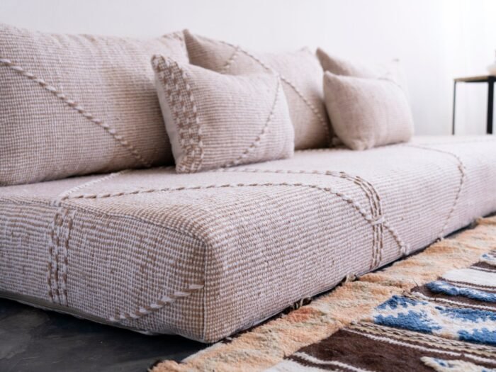 Left view of Moroccan floor seating in beige mixed with white – handmade cover set perfect for airy, cozy homes