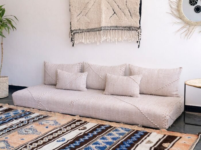 Right side of handmade Moroccan sofa in beige and white – soft, cozy floor seating for modern bohemian decor