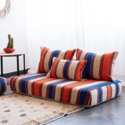 Right side view of Cream with Blue and Orange Stripes Moroccan wool floor sofa – handcrafted boho low seating with plain cushions for relaxed interiors