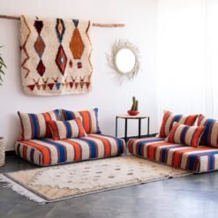 Left side view of Moroccan wool floor sofa in Cream with Blue and Orange Stripes – handwoven low seating with cushions for stylish home design