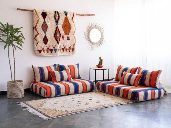 Left side view of Moroccan wool floor sofa in Cream with Blue and Orange Stripes – handwoven low seating with cushions for stylish home design