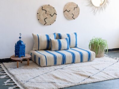Main image of Moroccan wool floor couch in cream with blue stripes – artisan low seating for modern, airy boho homes