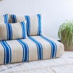 Pillows from Moroccan wool couch in cream and blue – artisan cushions for coastal bohemian décor