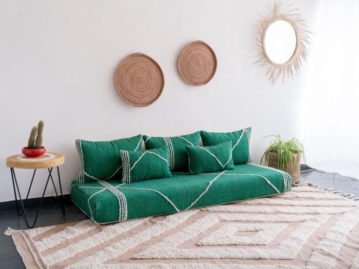 Left view of artisan green Moroccan floor sofa with plain cushions – ideal for natural and cozy living room styling