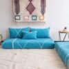 Artisan turquoise Moroccan floor sofa with matching plain cushions – perfect for coastal, boho, or modern living spaces