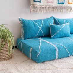 Left angle of artisan turquoise floor couch – Moroccan seating with a fresh and vibrant touch