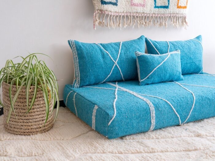 Left angle of artisan turquoise floor couch – Moroccan seating with a fresh and vibrant touch