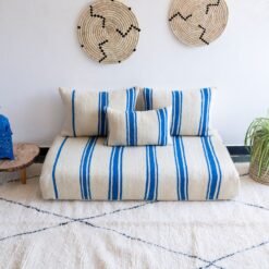 Top view of Moroccan wool couch in cream with soft blue lines – handmade for serene, boho-chic interiors