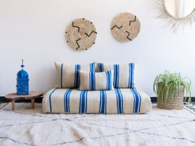 Main image of Moroccan wool floor couch in cream with blue stripes – artisan low seating for modern, airy boho homes