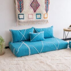 Left angle of artisan turquoise floor couch – Moroccan seating with a fresh and vibrant touch