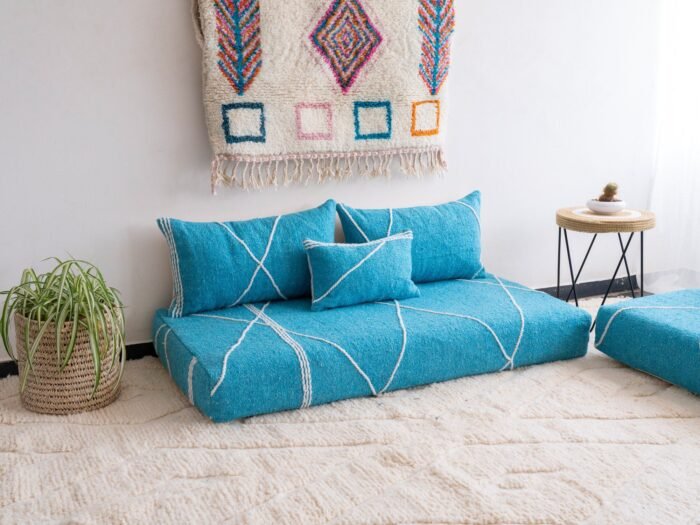 Left angle of artisan turquoise floor couch – Moroccan seating with a fresh and vibrant touch