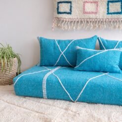 Close-up of turquoise cushions – handmade Moroccan pillows perfect for beachy, boho, or minimalist interiors