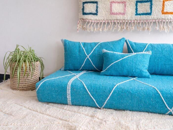 Close-up of turquoise cushions – handmade Moroccan pillows perfect for beachy, boho, or minimalist interiors