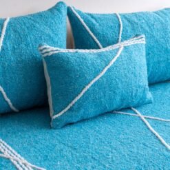 Close-up of turquoise cushions – handmade Moroccan pillows perfect for beachy, boho, or minimalist interiors
