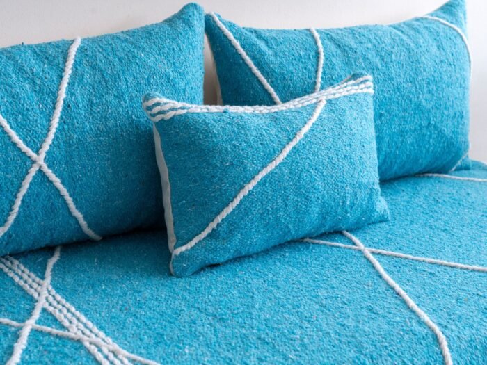 Close-up of turquoise cushions – handmade Moroccan pillows perfect for beachy, boho, or minimalist interiors