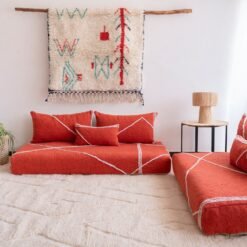 Right angle of orange Moroccan floor sofa – handcrafted warm-toned seating for bohemian and lively interiors
