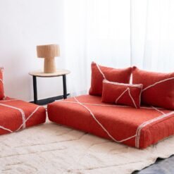 Right angle of orange Moroccan floor sofa – handcrafted warm-toned seating for bohemian and lively interiors