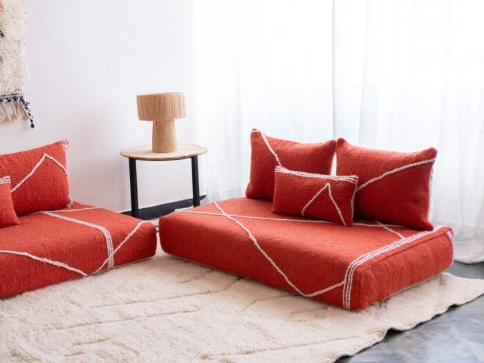 Right angle of orange Moroccan floor sofa – handcrafted warm-toned seating for bohemian and lively interiors