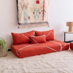 Left side view of handmade orange Moroccan couch – perfect for cozy and colorful living rooms