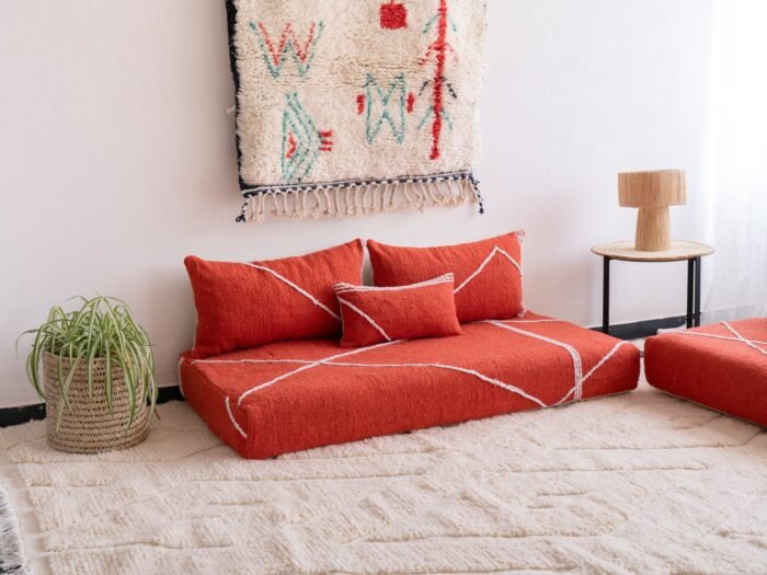 Left side view of handmade orange Moroccan couch – perfect for cozy and colorful living rooms