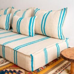 Right view of handmade Moroccan wool floor sofa in cream and turquoise – perfect for relaxed boho-chic homes