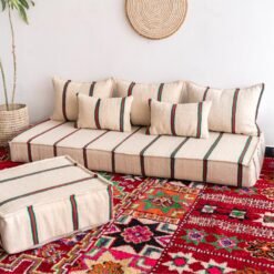 Right view of Moroccan floor sofa in cream with red and green – handmade wool couch for cozy living spaces