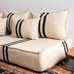 Right view of Moroccan wool sofa in cream with strong black lines – handcrafted low floor couch for minimalist interiors