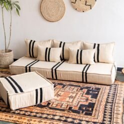 Right view of Moroccan wool sofa in cream with strong black lines – handcrafted low floor couch for minimalist interiors