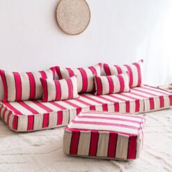 Left view of handmade Moroccan floor sofa in cream with bold red and black lines – traditional wool seating with a modern touch