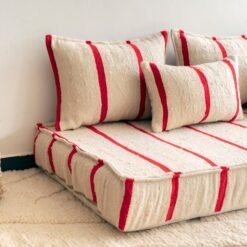Left side of Moroccan wool floor sofa in cream with red stripes – handmade seating for stylish boho and rustic home decor