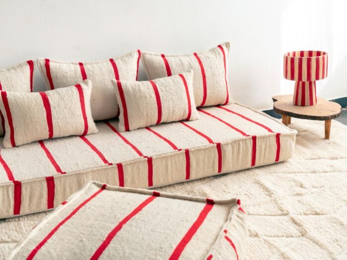Top view of Moroccan wool sofa in cream with delicate red lines – handcrafted floor seating set for cozy homes