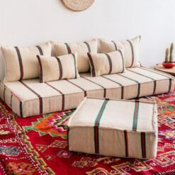 Left side of artisan wool floor sofa in festive red and green stripes – Moroccan handmade low seating