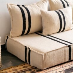 Left side image of artisan Moroccan sofa in cream and black – ideal for modern bohemian décor