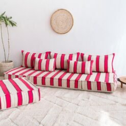 Right side of Moroccan wool floor sofa with artisan red and black striped pattern – cozy low seating for modern bohemian interiors