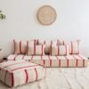 Main image of Moroccan handmade wool floor sofa in cream with thin red lines – elegant low seating for boho homes in the UK, US, and Australia