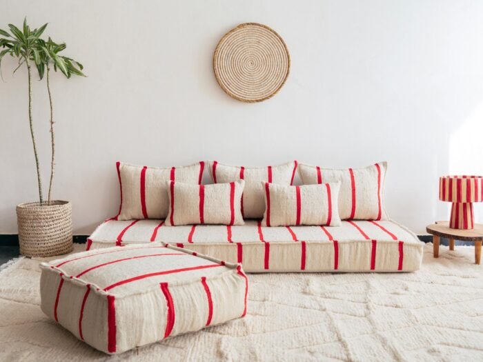 Main image of Moroccan handmade wool floor sofa in cream with thin red lines – elegant low seating for boho homes in the UK, US, and Australia