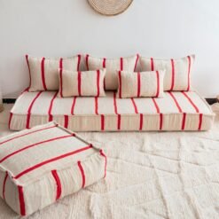 Main image of Moroccan wool floor sofa in cream with red stripes – handcrafted low seating with cushion covers for cozy boho interiors in the USA, UK, and Australia