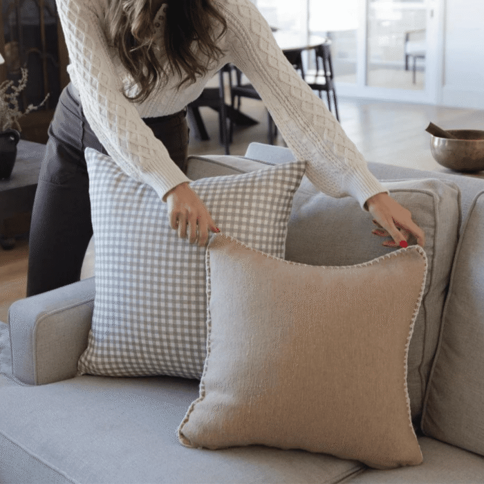 Side profile of a boho Moroccan tan cushion with artisan cream embroidery – handmade cotton pillow for natural, cozy interior spaces