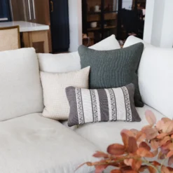 Dark green pillows styled in contemporary living space – handwoven Moroccan cotton throw pillows for cozy and stylish interiors