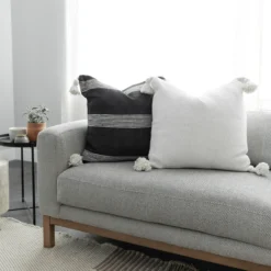 handmade white cotton Moroccan pillow featuring pompom accents – available in 18", 20", and 22" for cozy and modern interiors