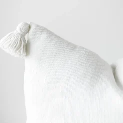 handwoven white Moroccan cushion with soft cotton pompoms – minimalist pillow design in various sizes for home styling