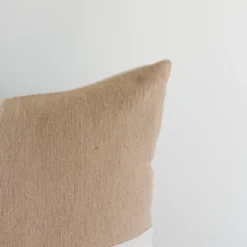 Left view of Moroccan pillow with soft tan and cream checker pattern – artisanal cushion for cozy modern spaces