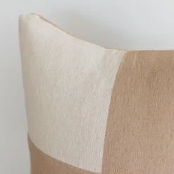 Right-side angle of handmade Moroccan cotton pillow with cream and tan checkerboard design – neutral tone accent cushion